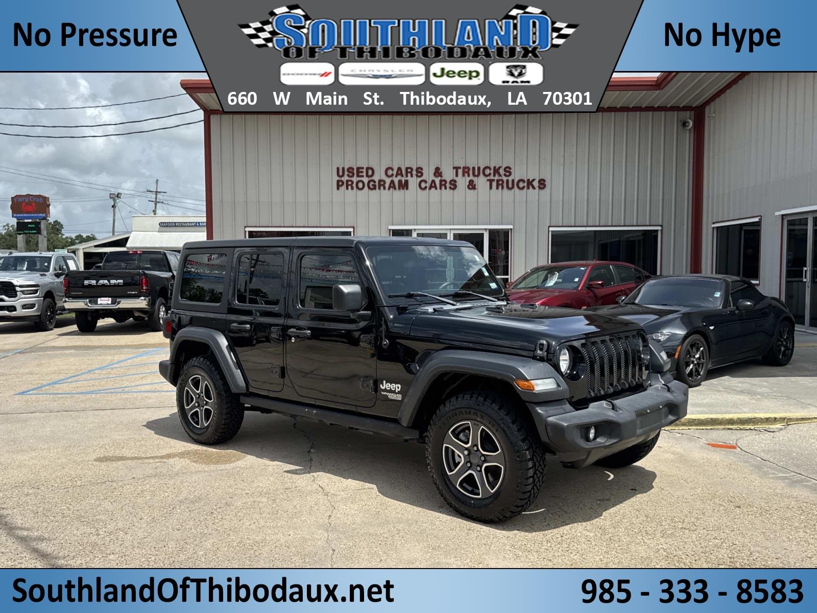 Used 2020 Black Clearcoat Jeep Sport S image 1