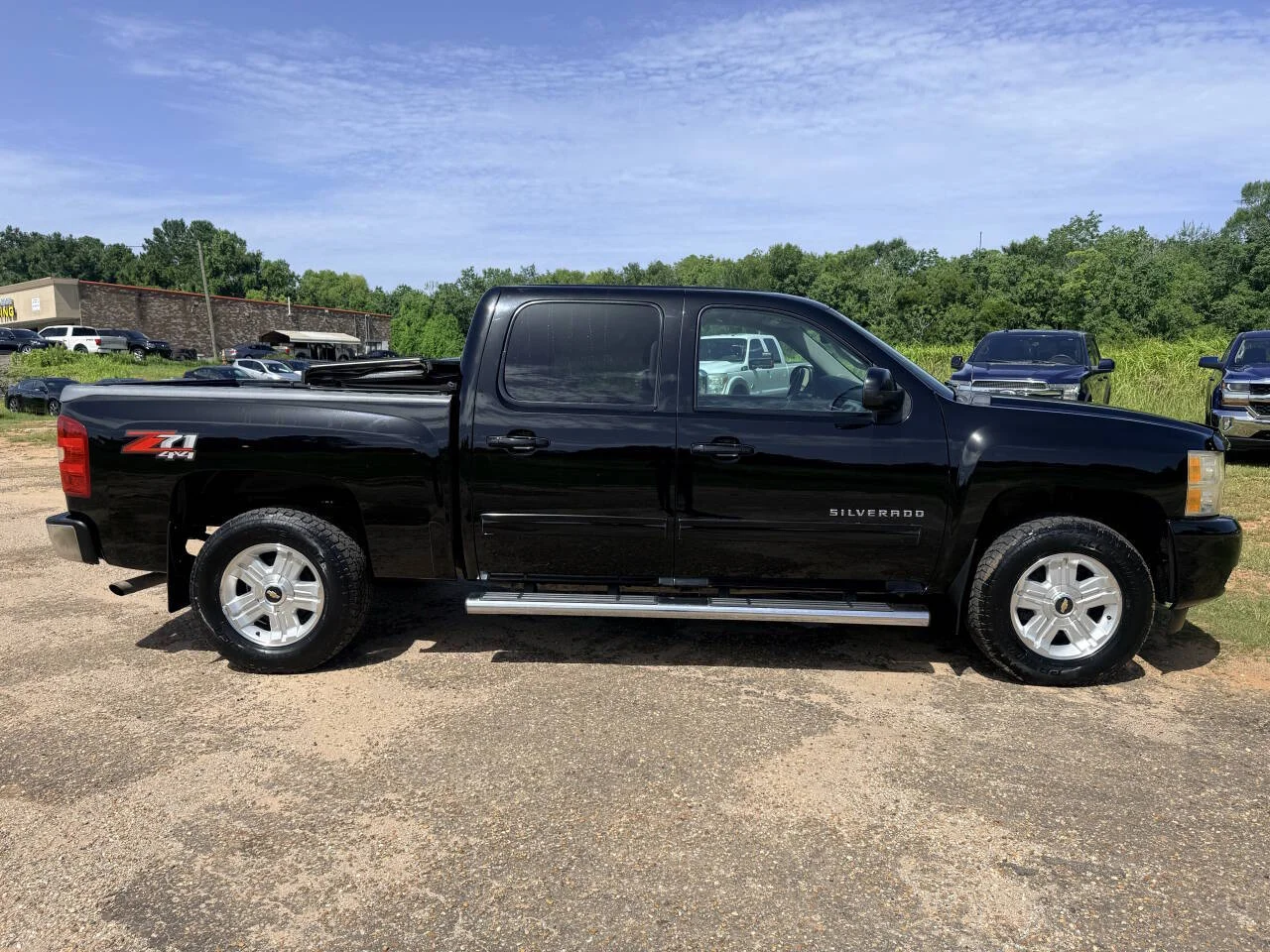 Used 2013 Black Chevrolet LTZ 4x4 4dr Crew Cab 5.8 ft. SB image 6
