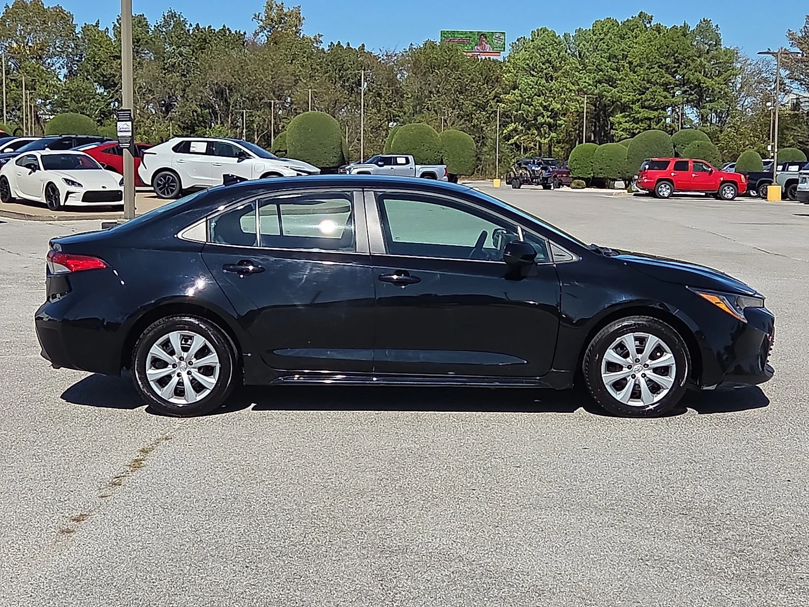 Used 2025 Midnight Black Metallic Toyota LE image 6