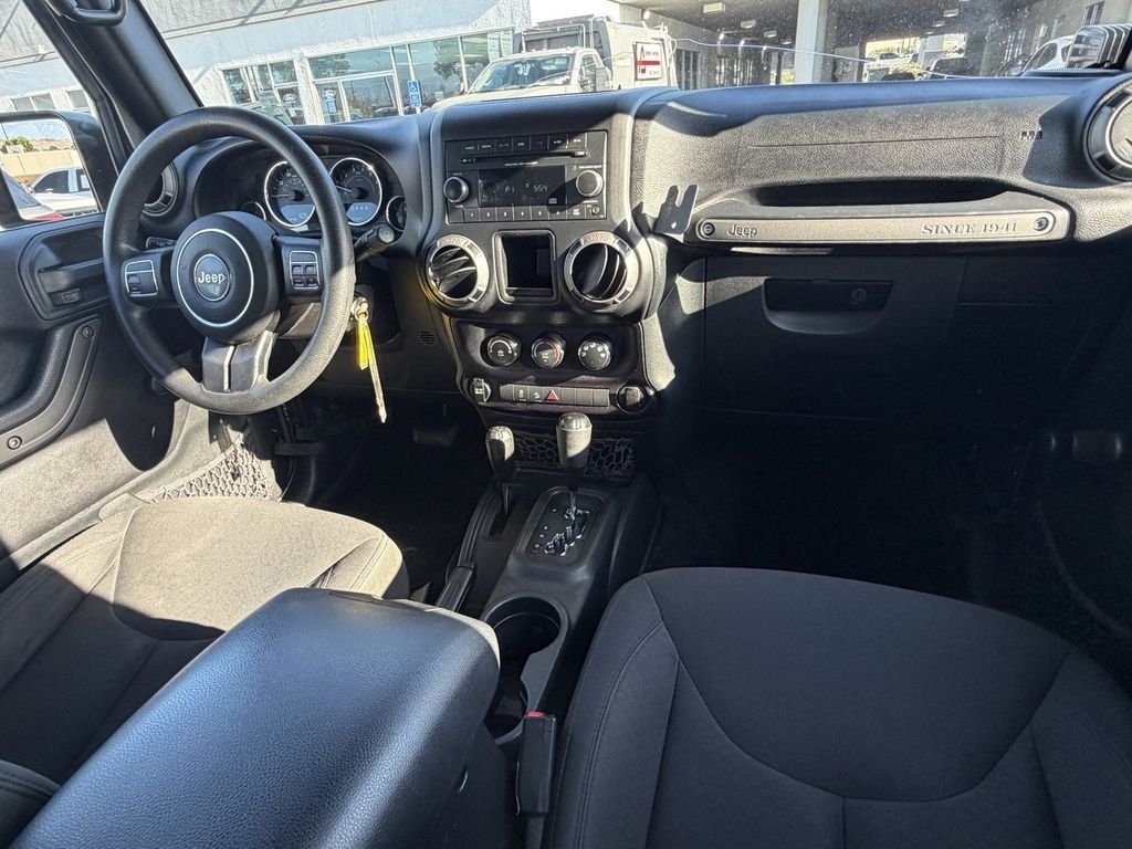 Used 2016 Granite Crystal Clearcoat Metallic Jeep Unlimited Sport image 16