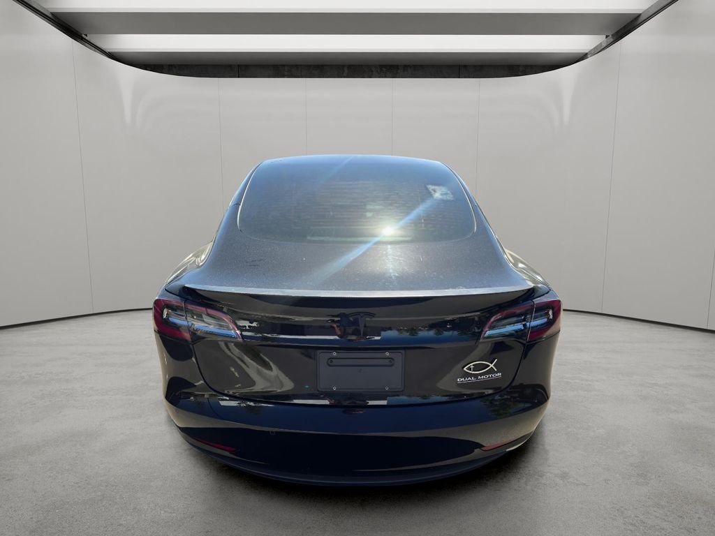 Used 2022 Solid Black Tesla Performance image 8