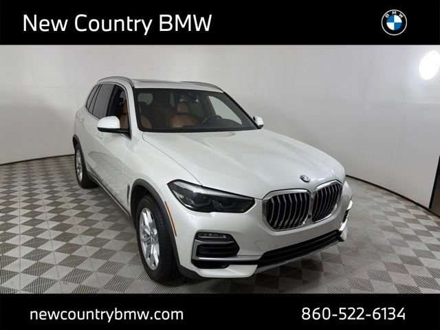 Used 2021 Mineral White Metallic BMW xDrive40i image 1