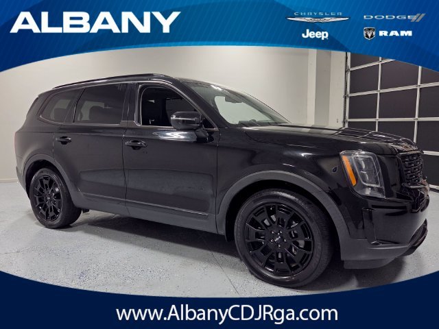 Used 2022 Black Kia EX image 1