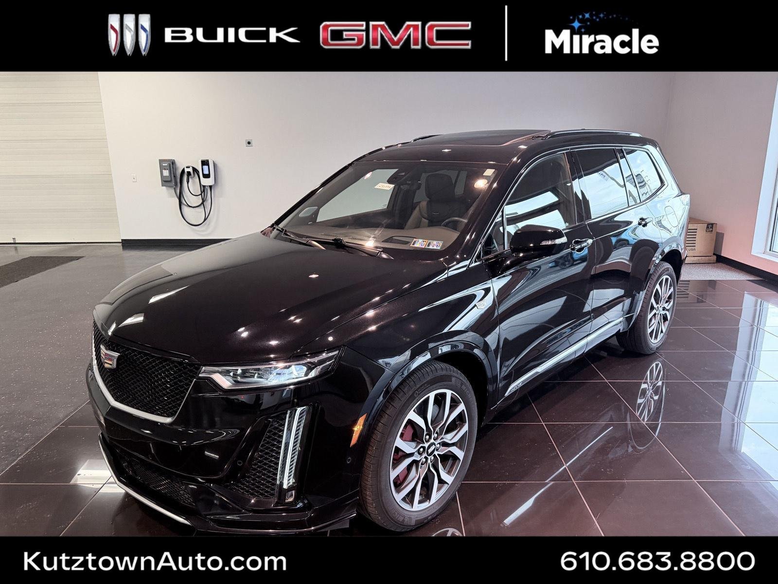 Used 2024 Stellar Black Metallic Cadillac Sport image 1