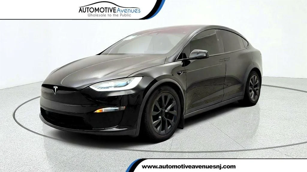 Used 2023 Solid Black Tesla AWD image 1