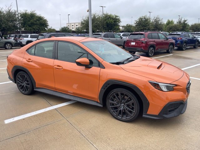 Used 2023 Solar Orange Pearl Subaru Premium image 1