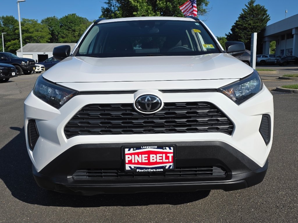 Used 2021 Super White Toyota LE image 9