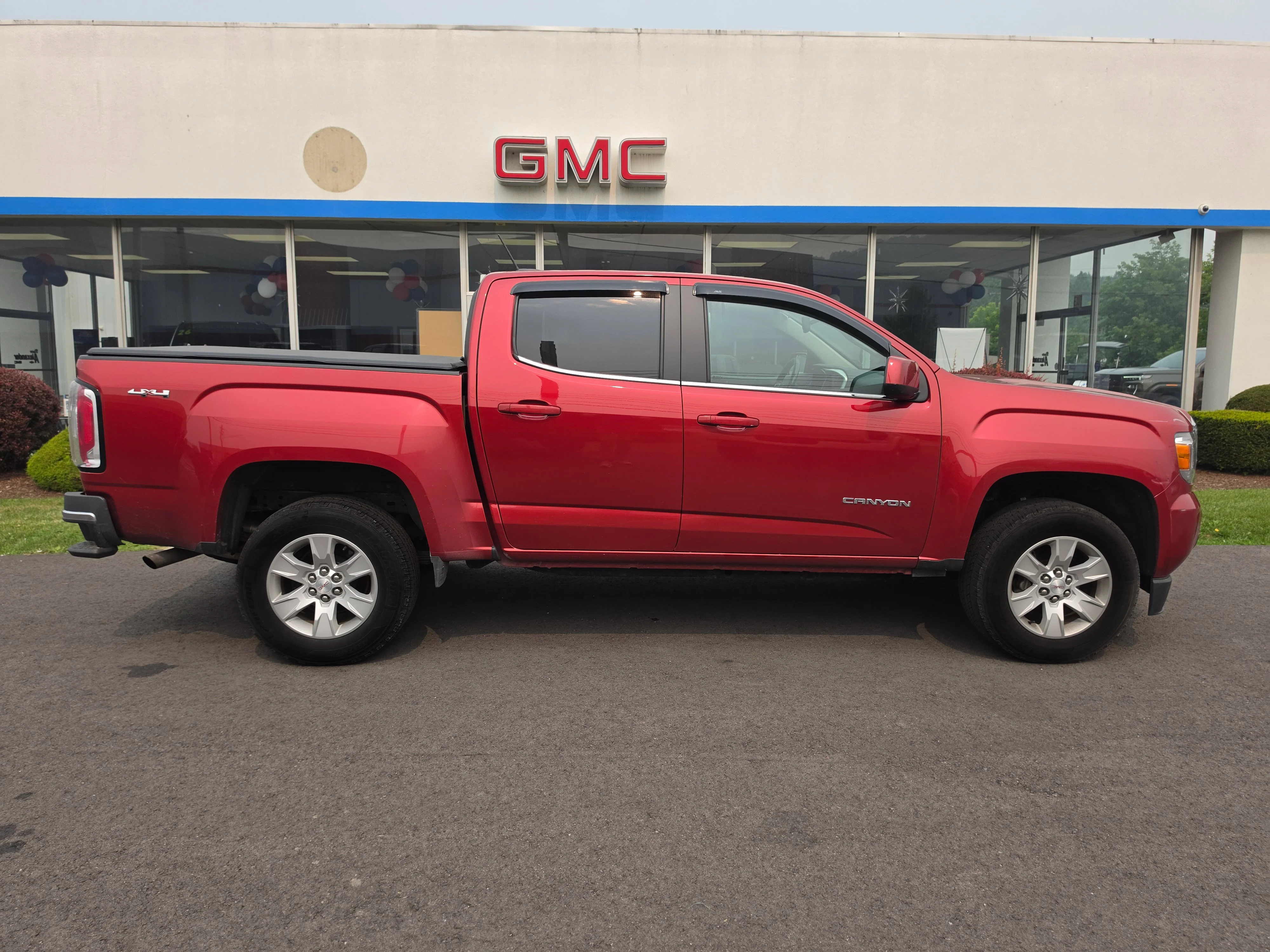 Used 2016 Copper Red Metallic GMC 4WD SLE image 2