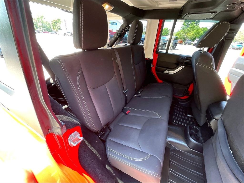 Used 2015 Red Jeep Unlimited Sahara image 18