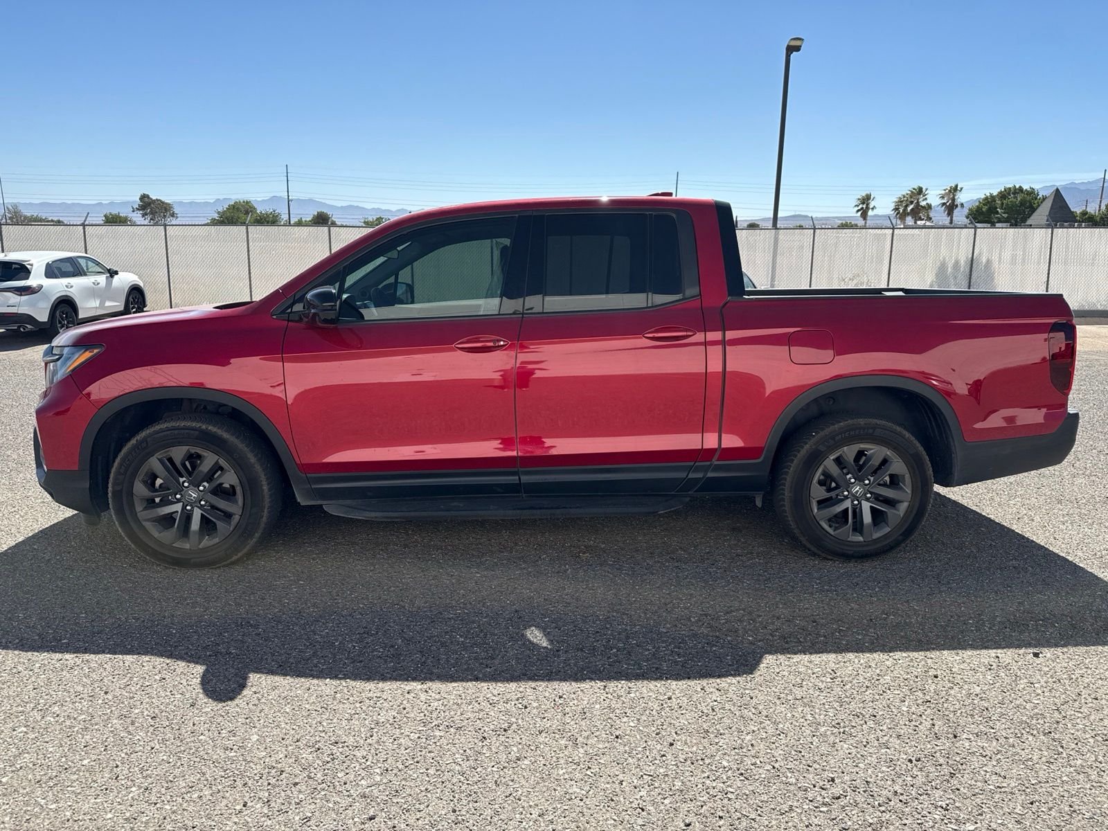 Certified Used 2021 Radiant Red Metallic II Honda AWD SPORT image 2
