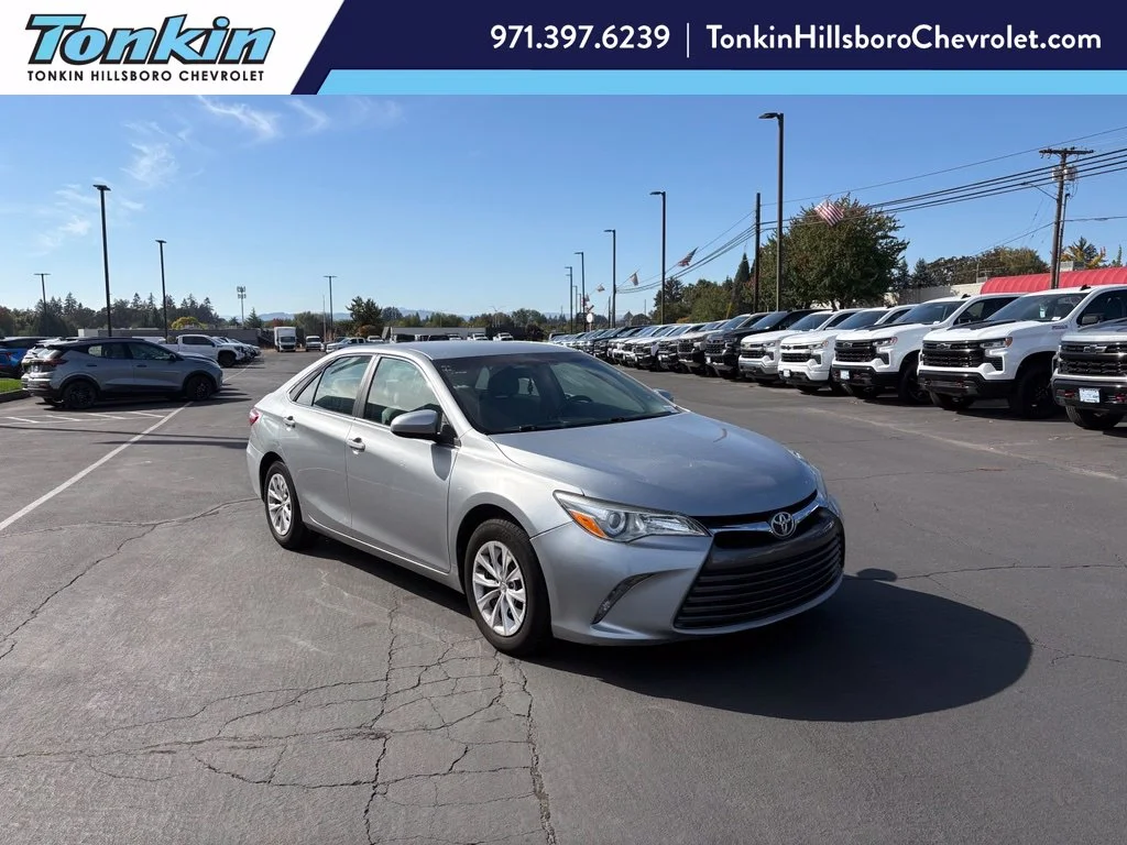 Used 2015 Celestial Silver Metallic Toyota LE image 1