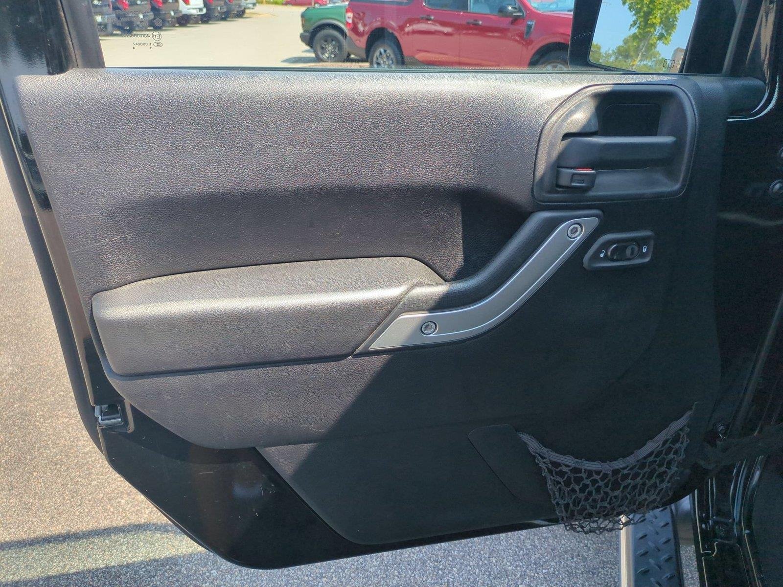 Used 2012 Black Clearcoat Jeep Sahara image 14