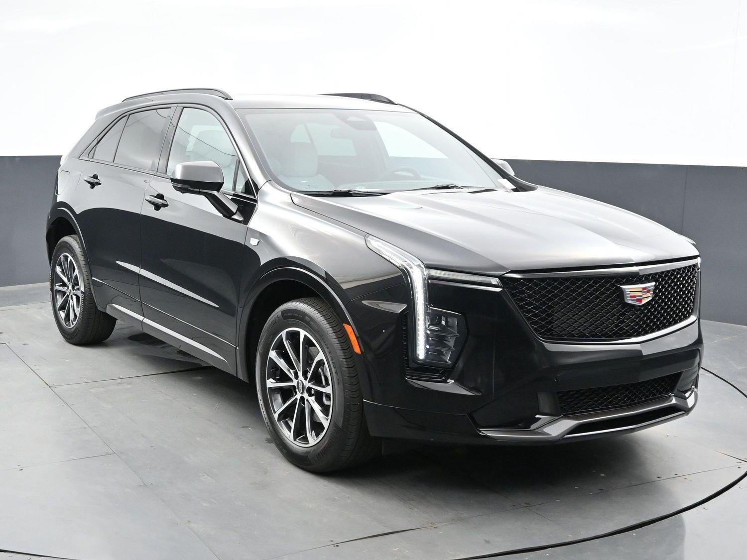 Used 2024 Stellar Black Metallic Cadillac Sport image 2