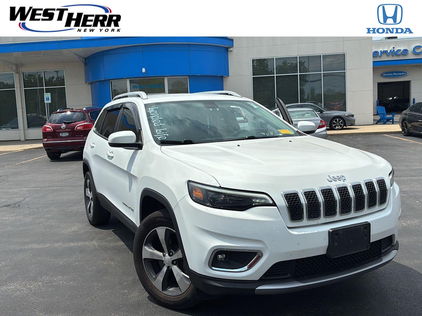 Used 2019 Bright White Clearcoat Jeep Limited image 1