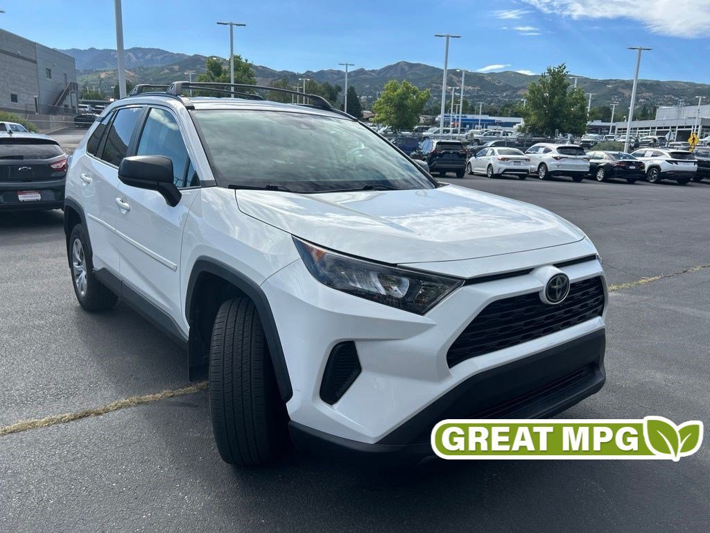 Used 2021 Super White Toyota LE image 1