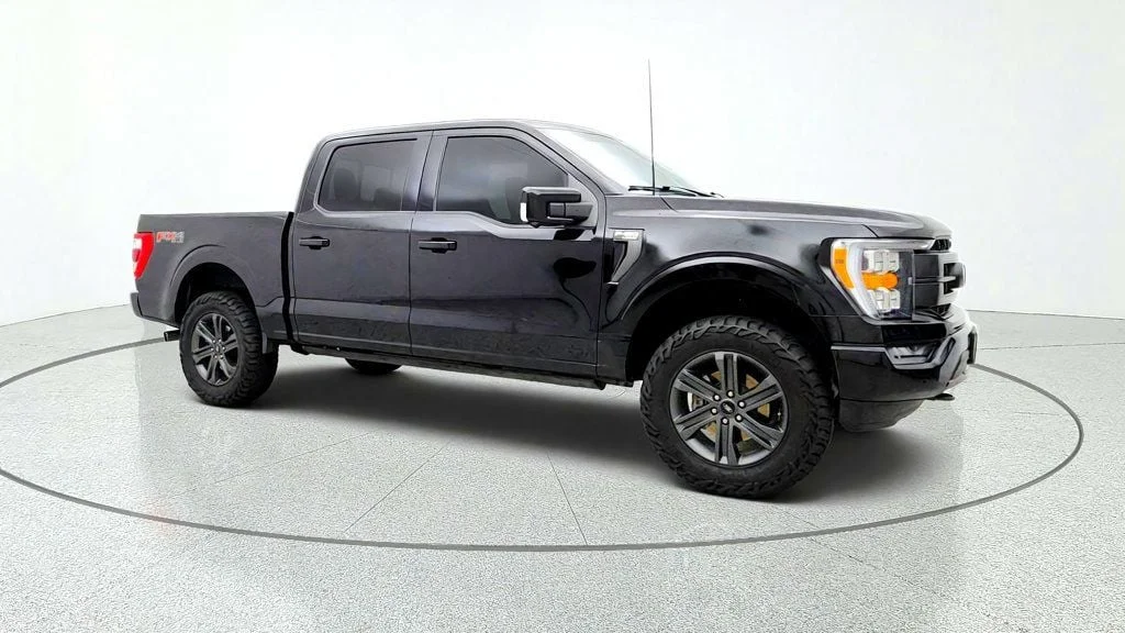 Used 2023 Agate Black Metallic Ford LARIAT 4WD SuperCrew 5.5