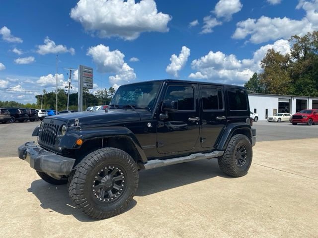 Used 2014 Jeep Wrangler Unlimited Sahara with VIN 1C4BJWEG2EL306377 for sale in Fordyce, AR