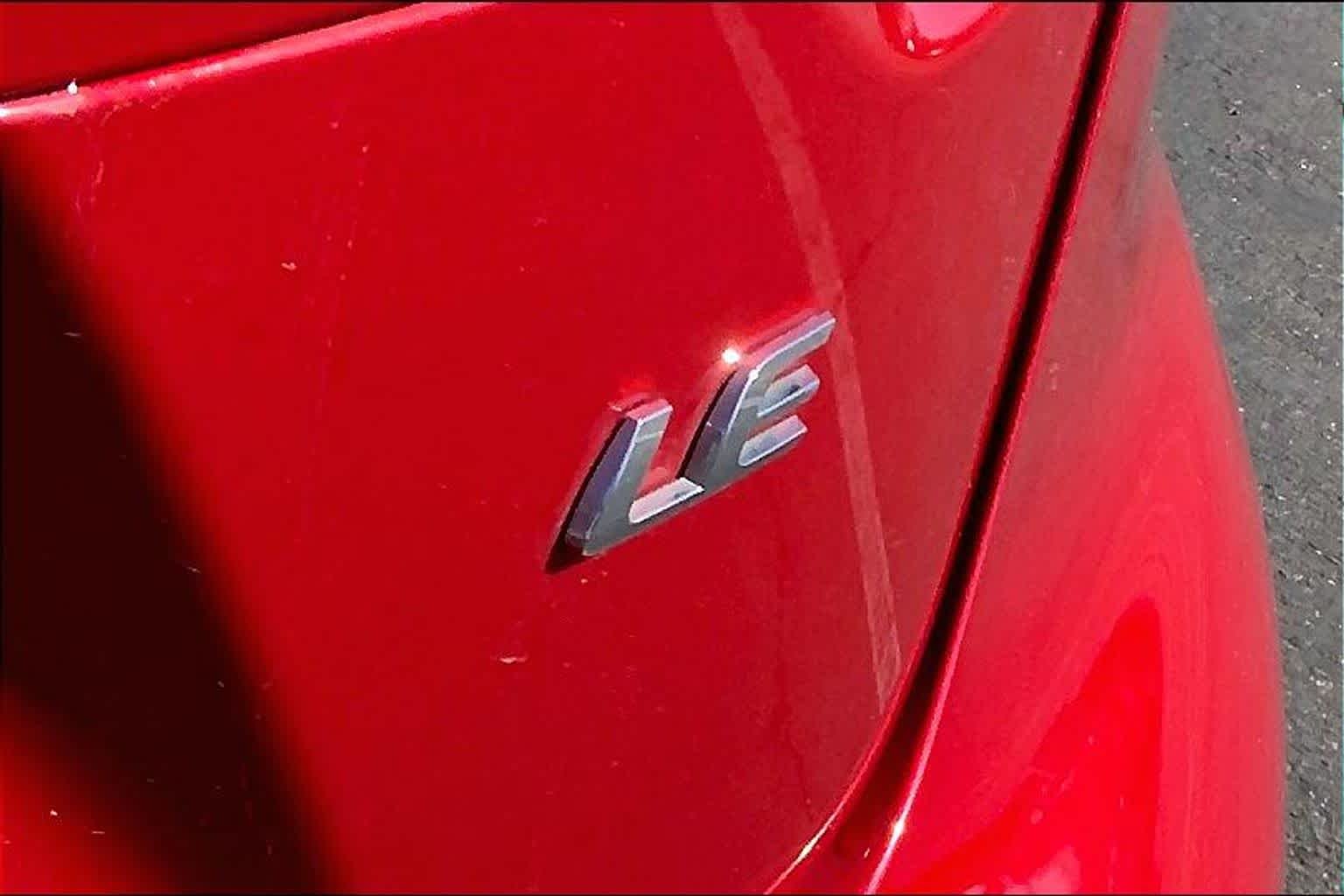 Used 2021 Barcelona Red Metallic Toyota LE image 9