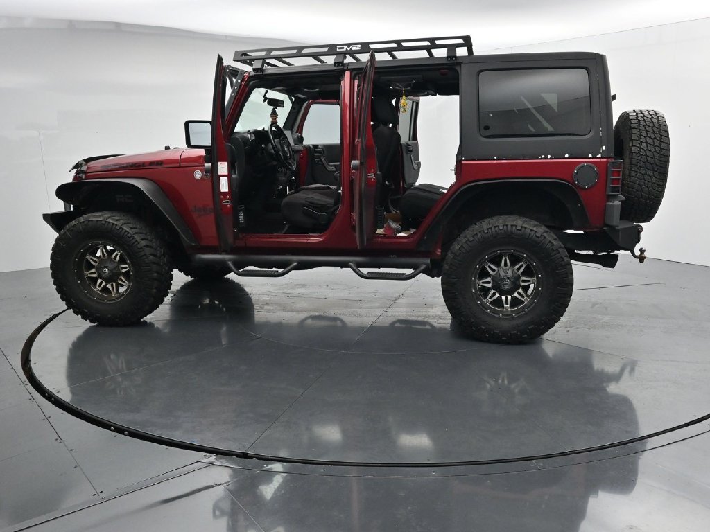Used 2012 Red Jeep Unlimited Sport image 28