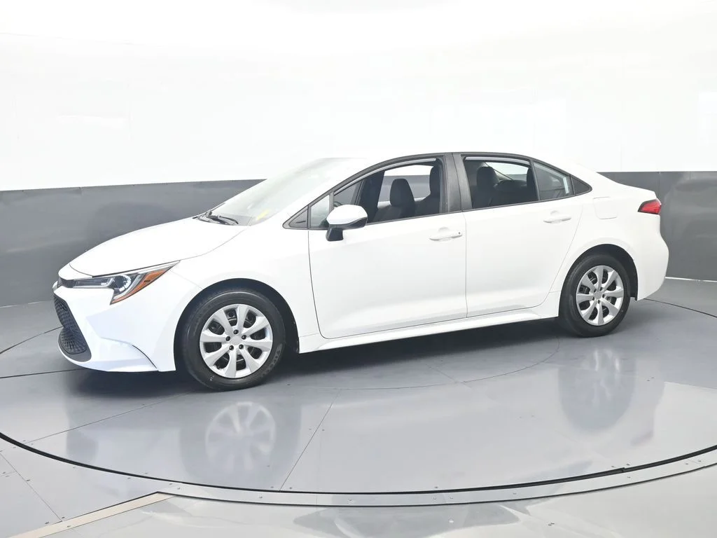 Used 2021 Super White Toyota LE image 1