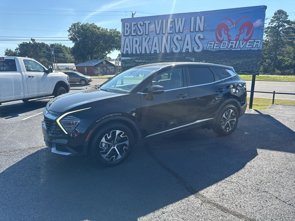 Used 2024 Ebony Black Kia EX image 1