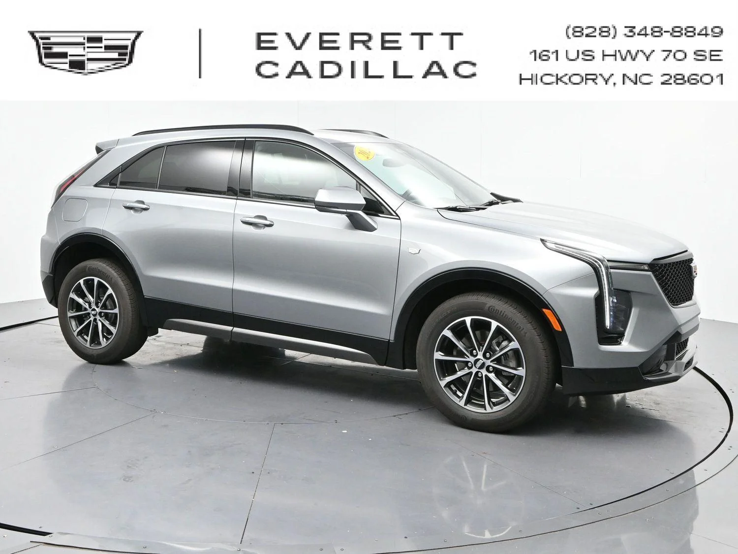 Used 2024 Argent Silver Metallic Cadillac Sport image 1
