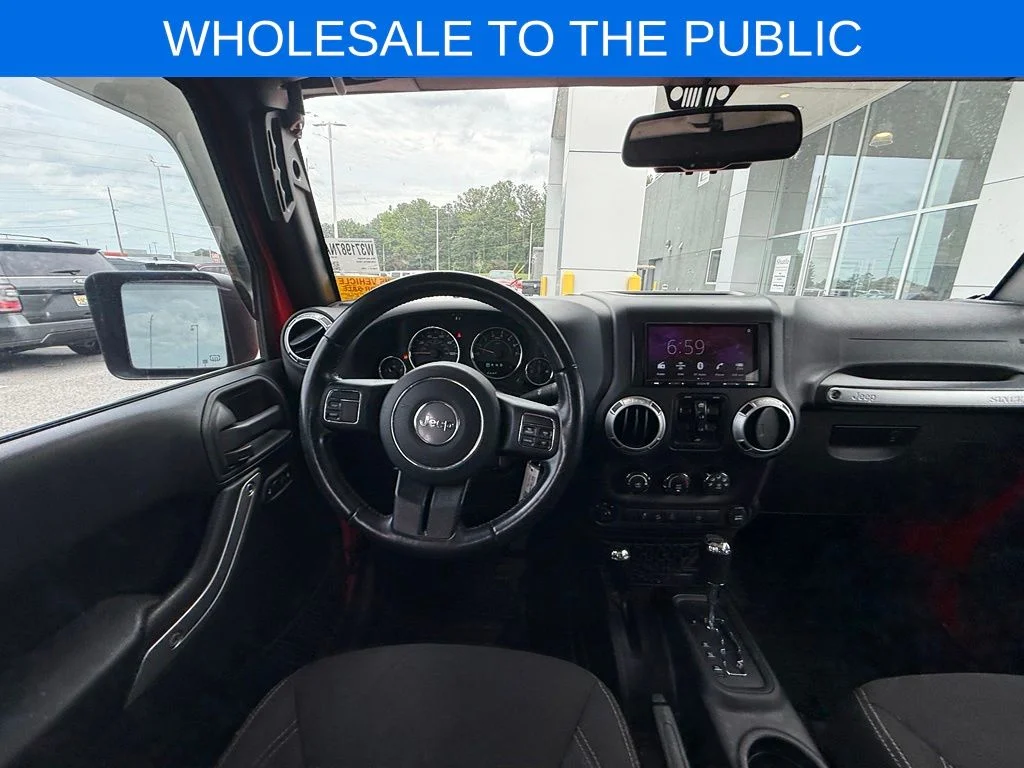 Used 2016 Red Jeep Unlimited Sahara image 6