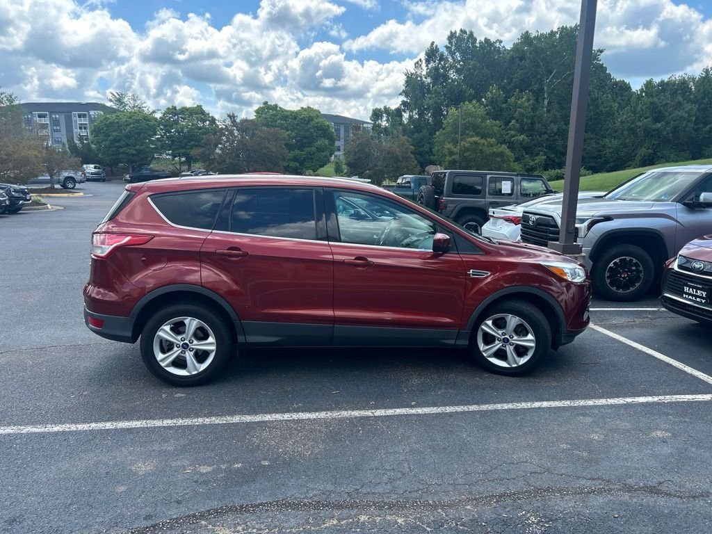 Used 2015 Orange Ford SE image 2