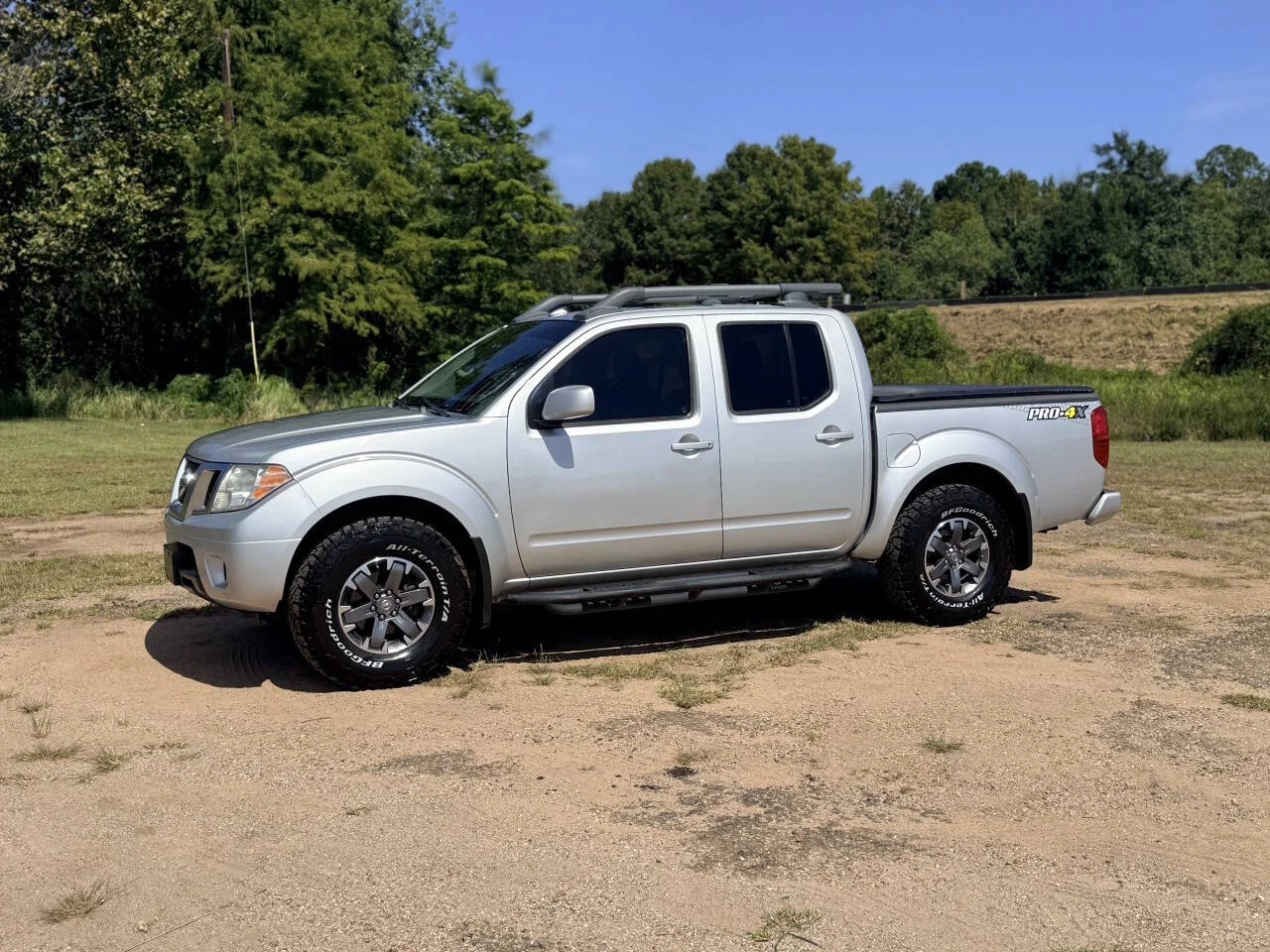 Used 2016 Silver Nissan PRO 4X 4x4 4dr Crew Cab 5 ft. SB Pickup 5A image 1