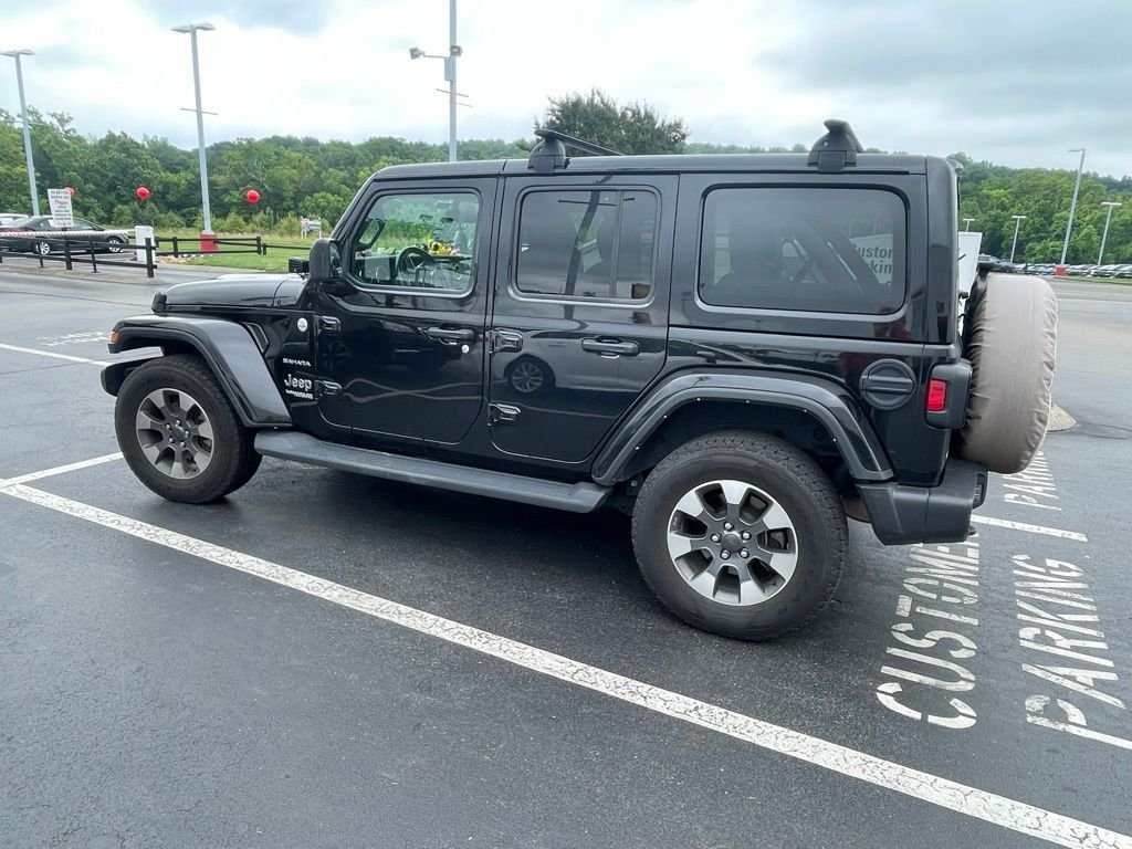 Used 2022 Black Jeep Unlimited Sahara image 1