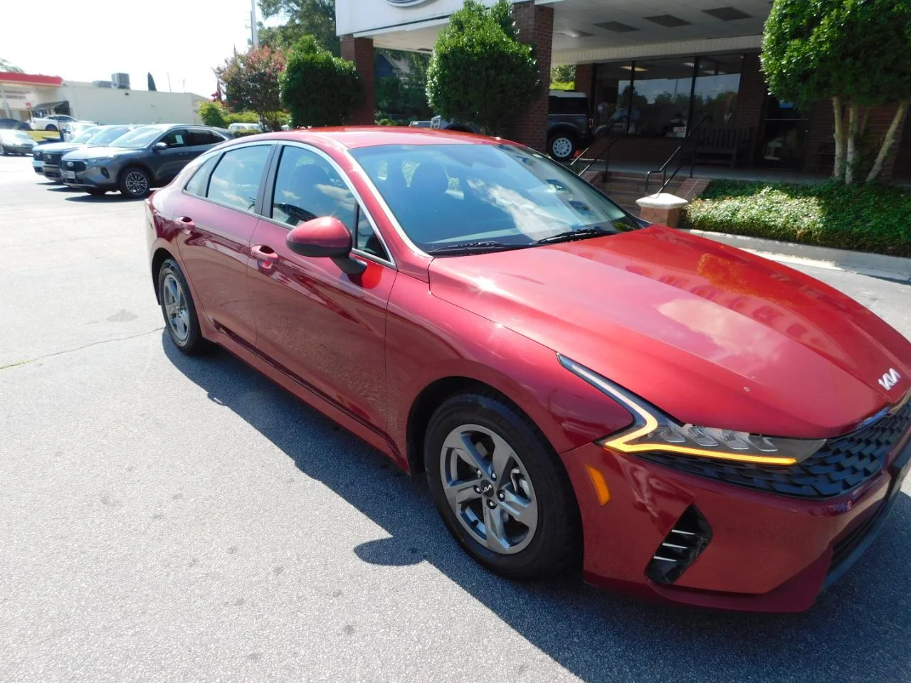Used 2023 Burgundy Kia LXS AUTO FWD image 2