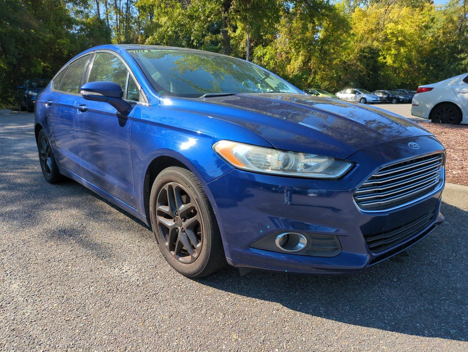Used 2016 Deep Impact Blue Ford SE image 1