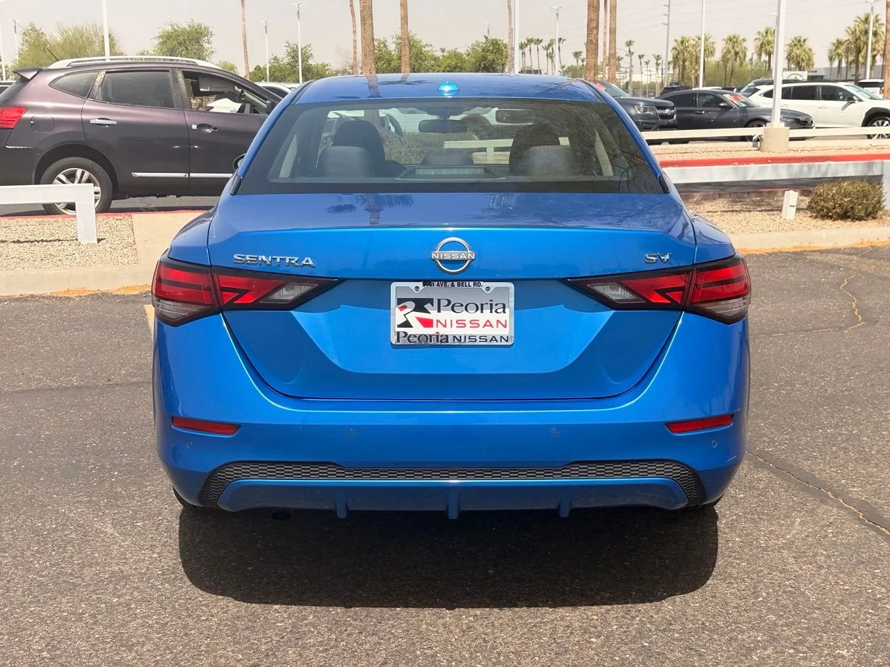 Used 2024 Electric Blue Metallic Nissan SV image 4
