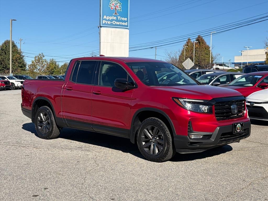 Used 2021 Radiant Red Metallic II Honda AWD SPORT image 1