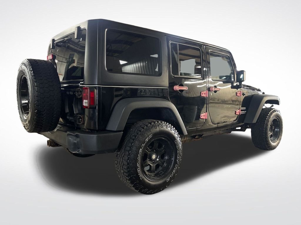 Used 2013 Black Jeep Unlimited Sport image 5