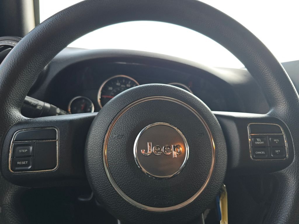 Used 2013 Black Jeep Unlimited Sport image 22
