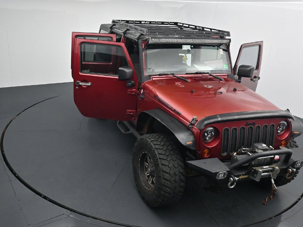Used 2012 Red Jeep Unlimited Sport image 25