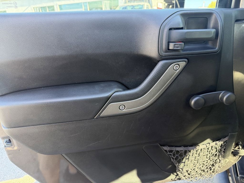 Used 2016 Granite Crystal Clearcoat Metallic Jeep Unlimited Sport image 24