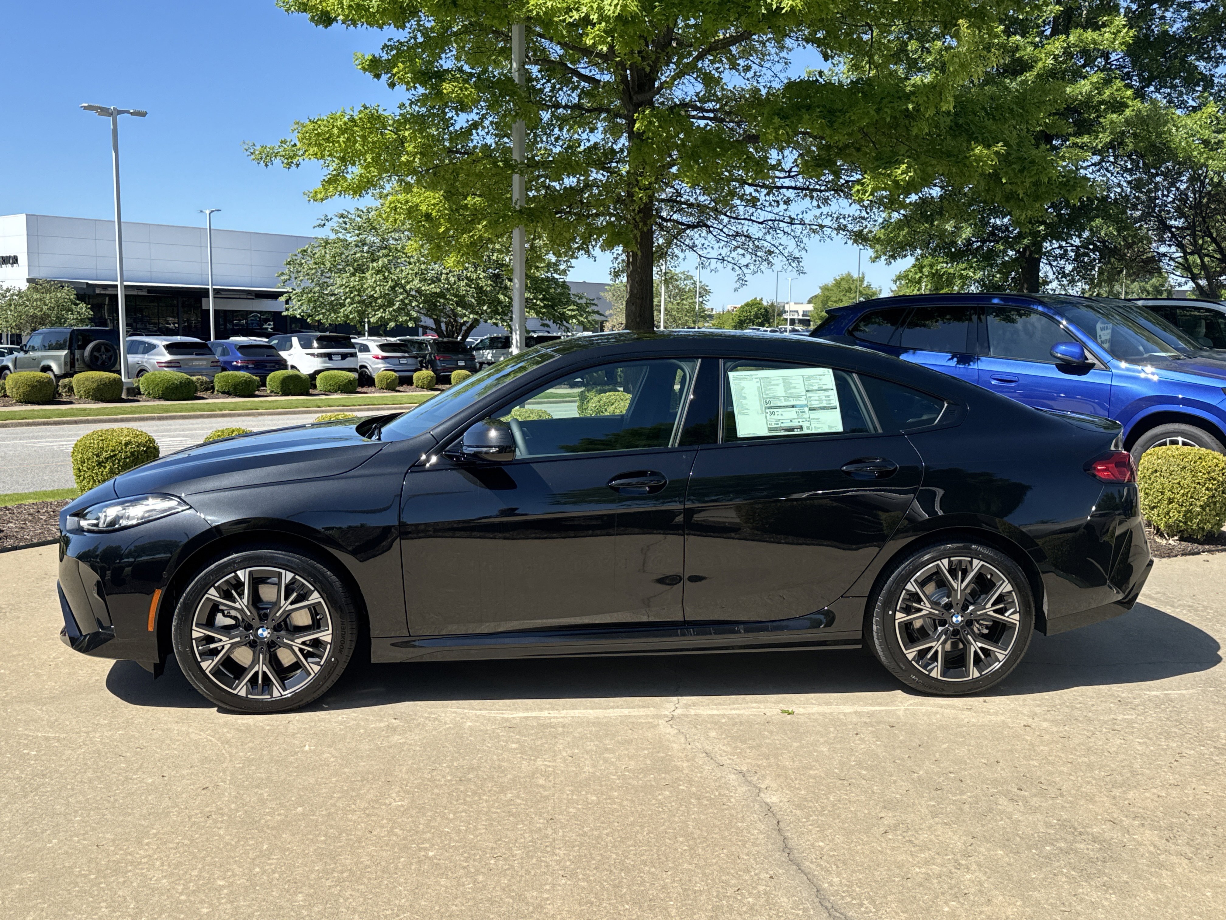New 2026 0475 Black Sapphire Metallic BMW 228 xDrive image 2
