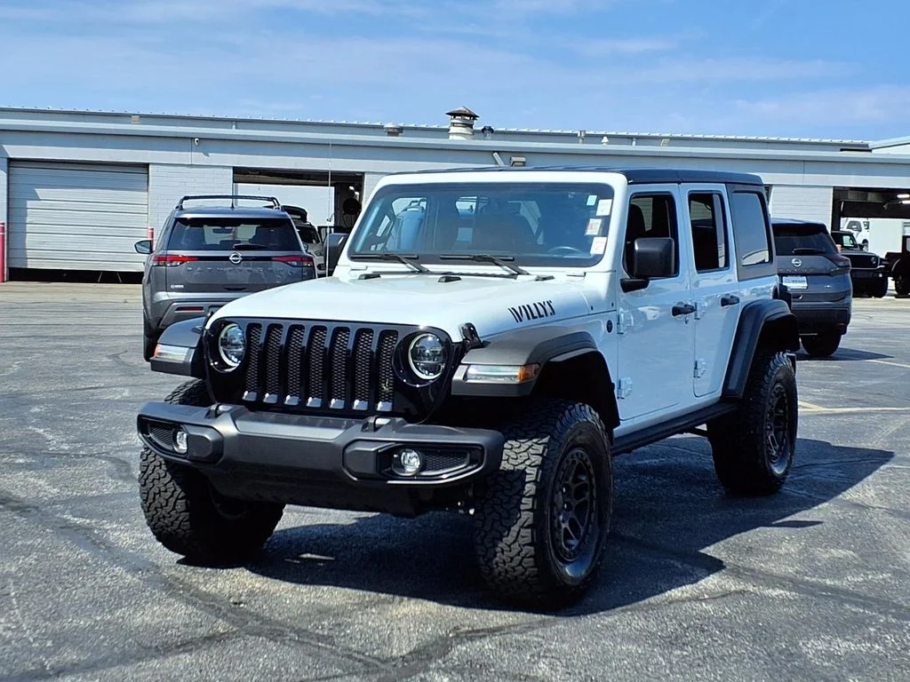 Used 2023 Jeep Wrangler 4-Door Willys with VIN 1C4HJXDNXPW521068 for sale in Kansas City