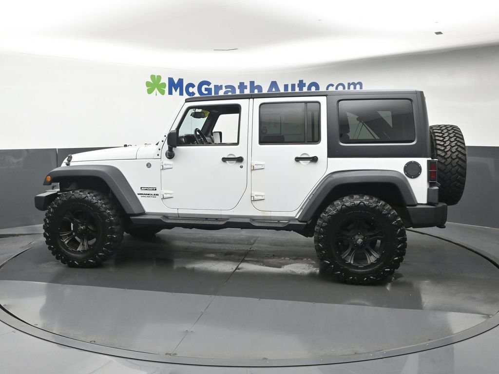 Used 2014 White Jeep Unlimited Sport image 23