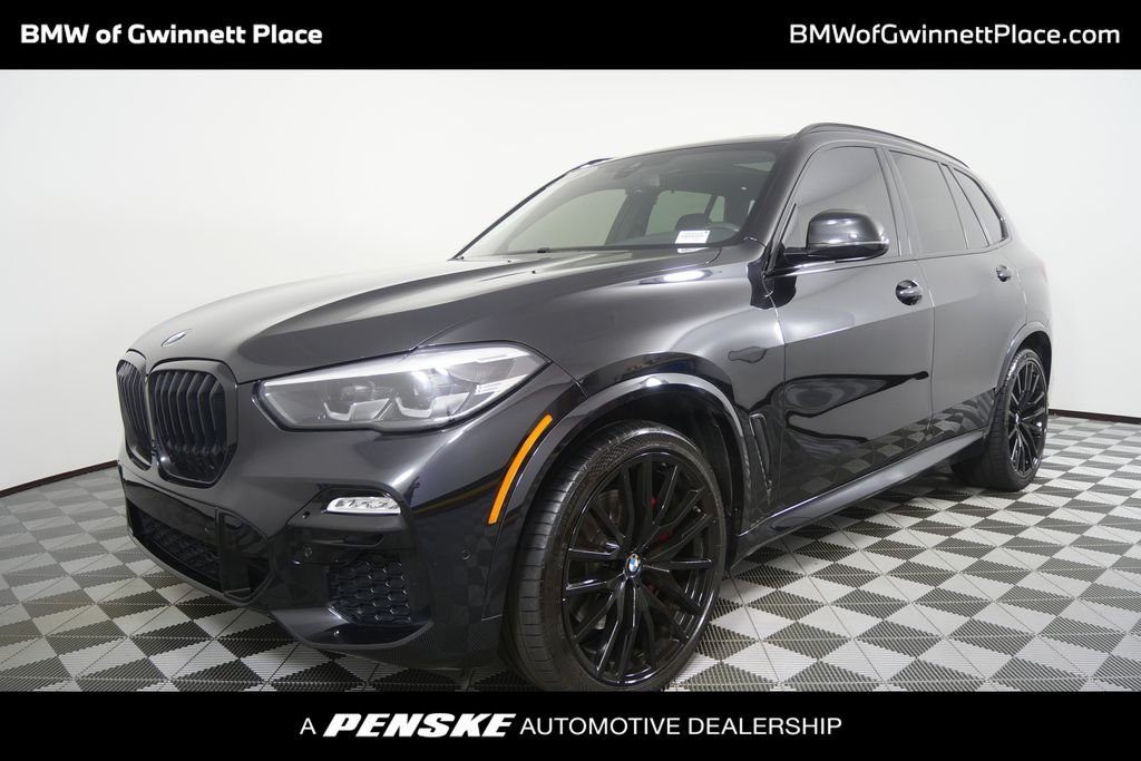 Used 2021 Black Sapphire Metallic BMW xDrive40i image 1
