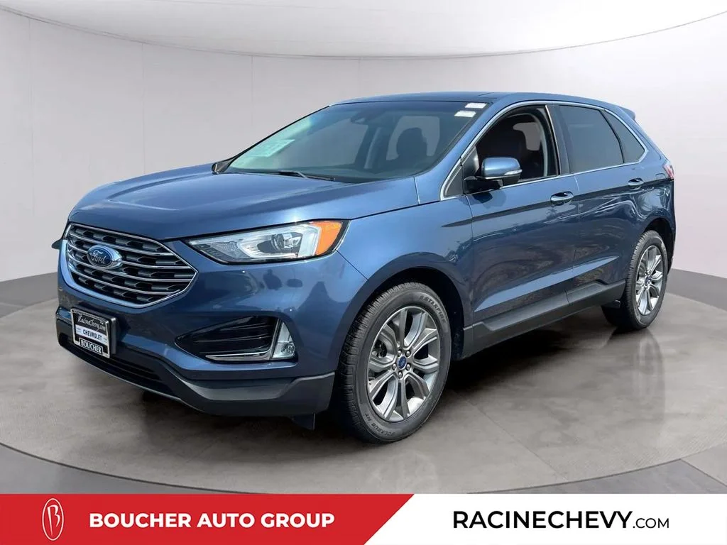 Used 2019 Blue Metallic Ford Titanium image 1