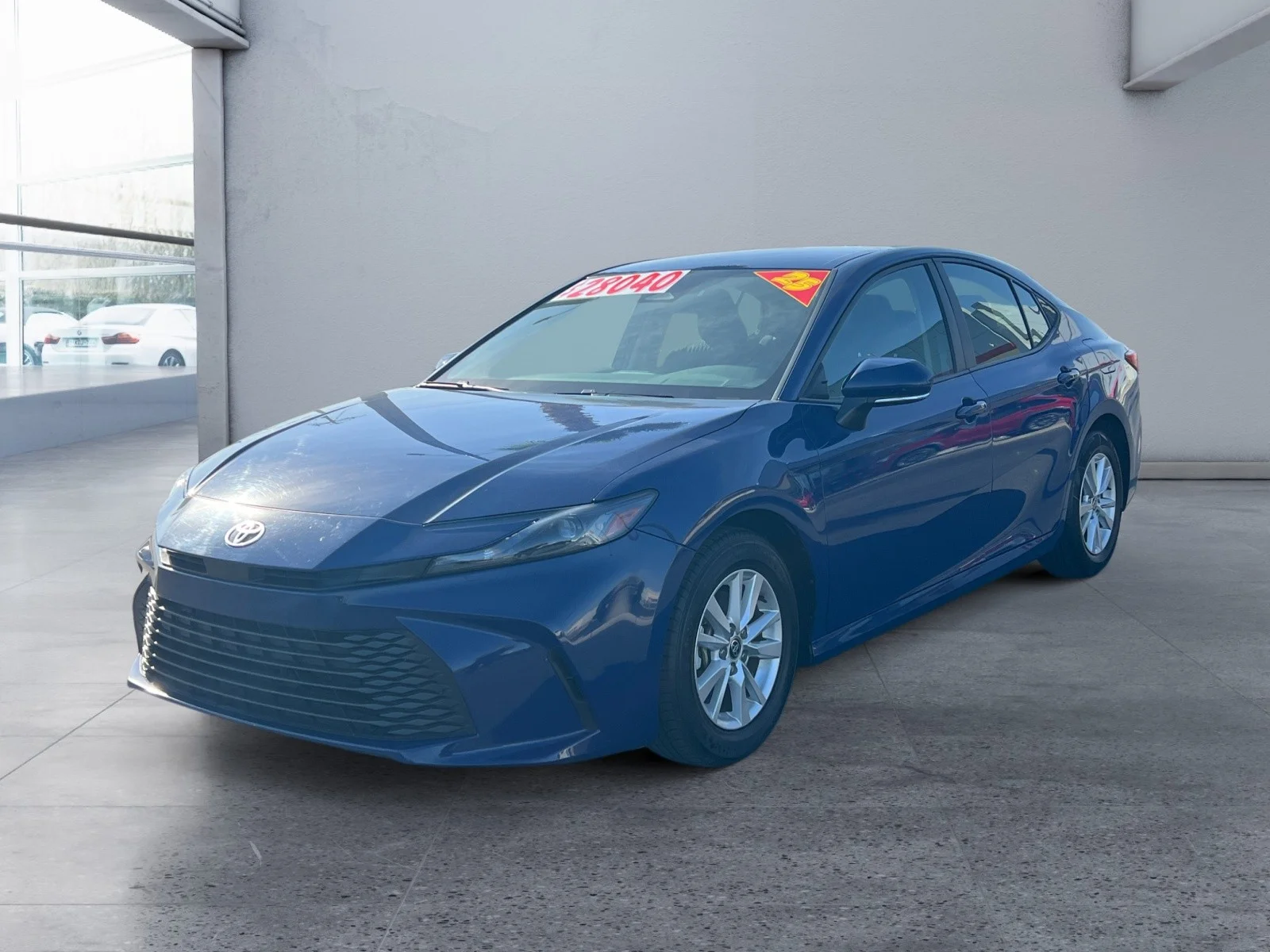 Used 2025 Reservoir Blue Toyota LE image 1