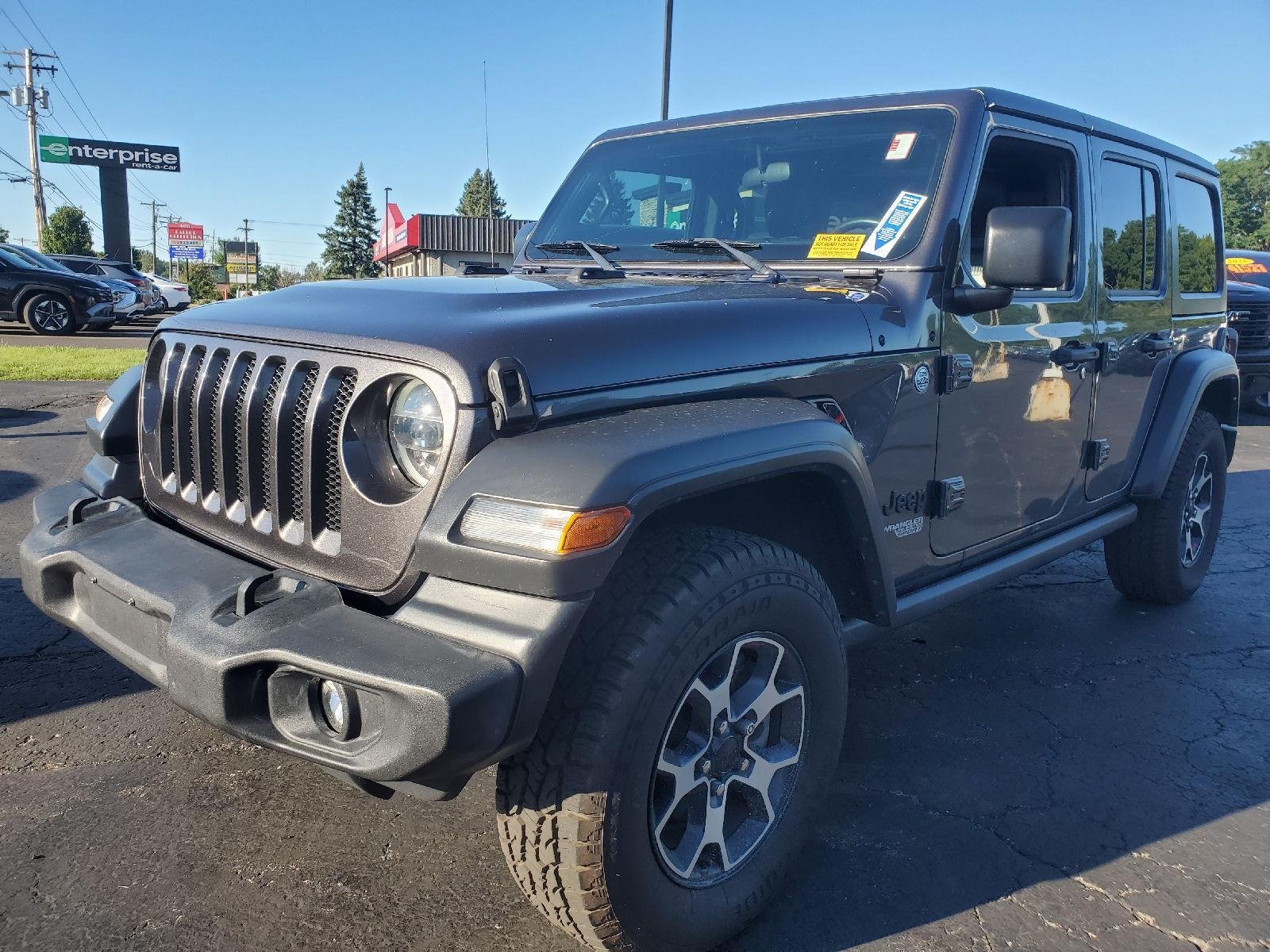 Used 2021 Granite Crystal Metallic Clearcoat Jeep Unlimited Sport S image 4