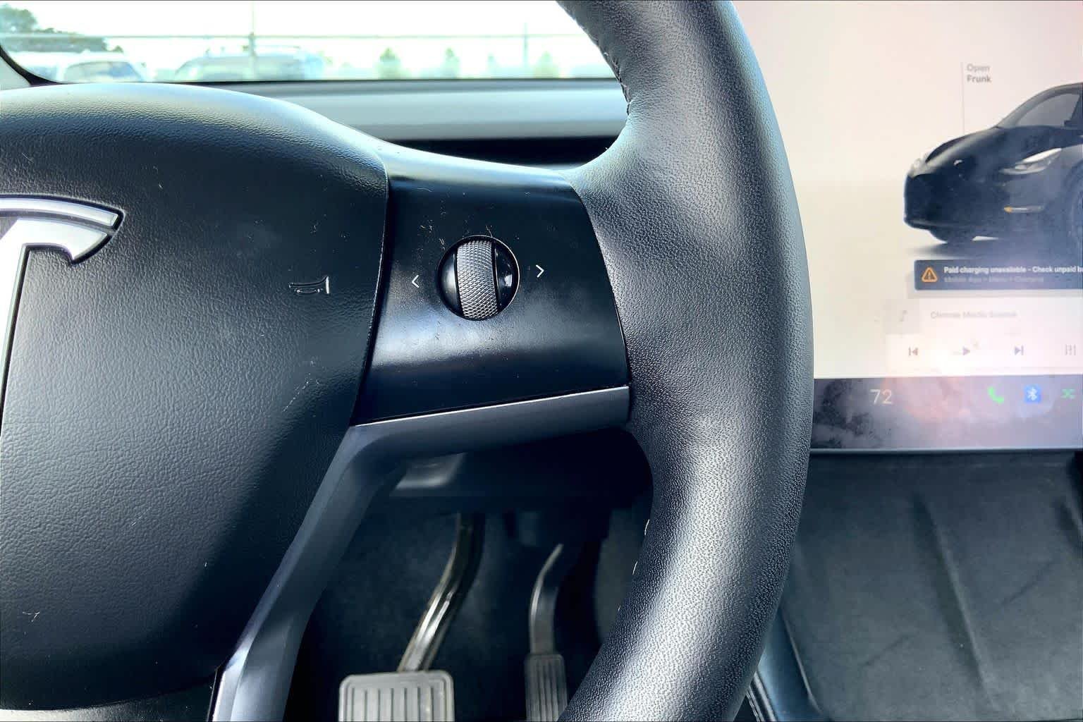 Used 2024 Solid Black Tesla  image 23