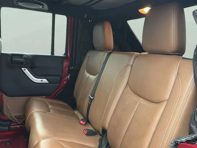 Used 2013 Red Jeep Unlimited Sahara image 17