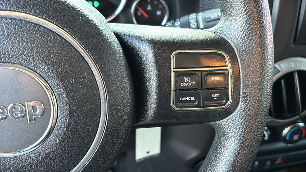 Used 2013 Billet Clearcoat Metallic Jeep Unlimited Sport image 12