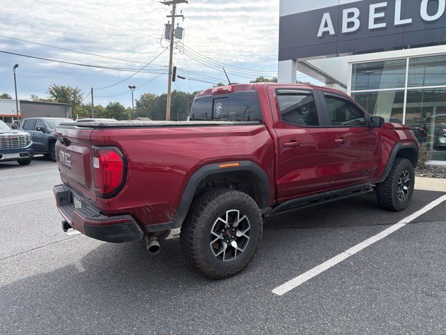 Used 2024 Volcanic Red Tintcoat GMC 4WD AT4X image 4
