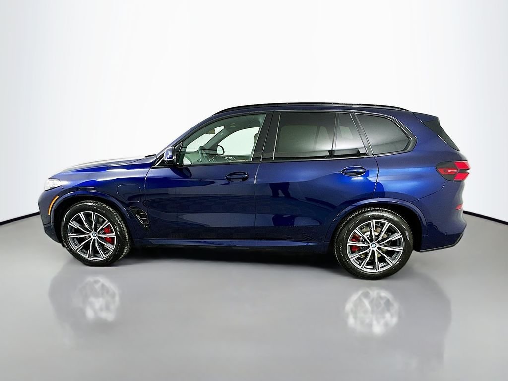 Used 2026 Tanzanite Blue II Metallic BMW xDrive50e image 8